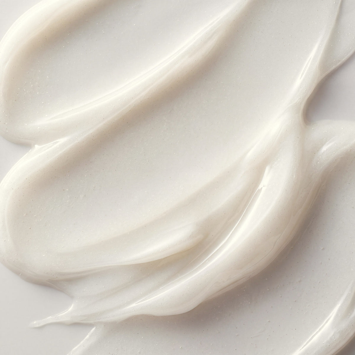 Close-up of the clear, translucent white Enzyme Cream Mask texture in soft sweeps