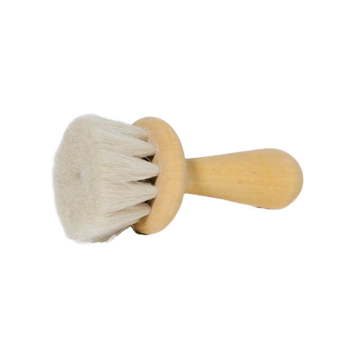 Pale wooden brush tilted to show its bristles